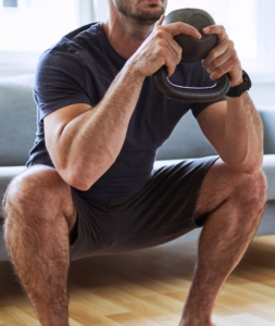 goblet squat kettlebell man